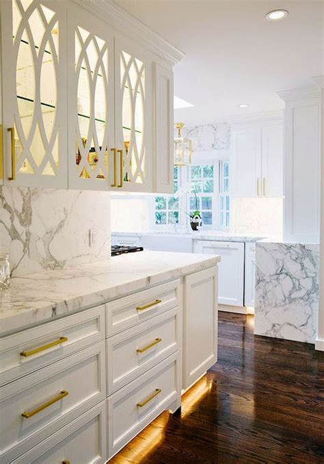 White Kitchen With Gold Hardware And Marble Counters By Evans