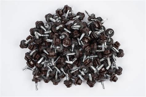 Self Tapping Screws For Fixing The Roof With Brown Hex Heads Stock