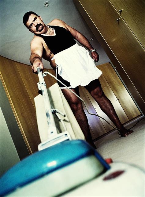 Overweight Man Wearing French Maid Outfit Vacuuming Floor Portrait By