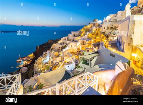 View Of White Washed Houses At Dusk In Oia Village Santorini Aegean