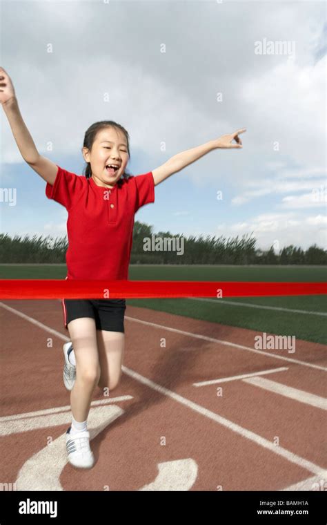 Girl Winning A Running Race And Cheering Happily Stock Photo 23809334