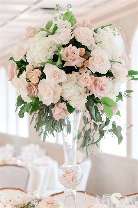 Tall Wedding Centerpieces In A Transparent Glass Vase