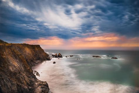 Cliffside View Of The Stormy Northern California Coast At Sunset