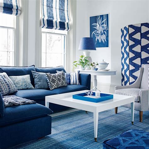 Blue And White Living Room With Cobalt Blue Sofa And Striped Blinds