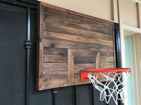 There are two different ways in which you can make a hoop of your own that can fit in any space. Handmade wooden Basketball Hoop by ReimaginedWoodcraft on Etsy https://www.etsy.com/listing ...