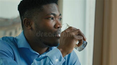 African American Healthy Man Drinking Water Glass Of Cold Fresh Drink