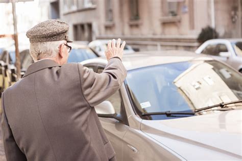 Old Man Waiting On A Cab Stock Photo Download Image Now Active