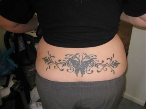 This tribal back tattoo only takes up a small portion of the back instead of taking over the entire back. Tribal Butterfly Image Tattoo On Lower Back || Tattoo from ...