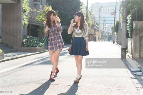 Japanese Women Walking On Streetsmiling Photo Getty Images