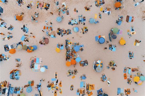 Aerial View Of People Sunbathing At A Beautiful Beach In Portugal