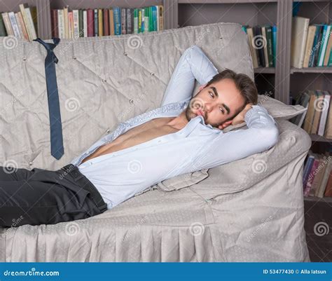 Young Man In A Suit Lying On The Sofa Stock Photo Image Of Person