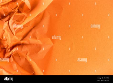 Close Up Shot Of Orange Crumpled Paper For Background Stock Photo Alamy