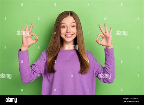 Portrait Of Nice Positive Girl With Long Hairstyle Wear Purple Long Sleeve Hands Showing Okey