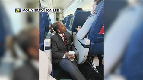 Delta Airlines Flight Attendant Caught On Video Consoling Passenger