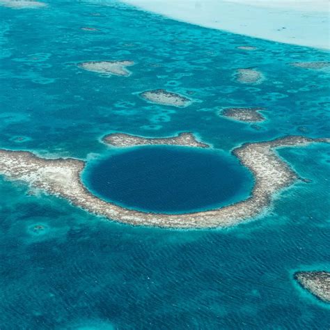 How To See The Great Blue Hole Belize Scenic Flight Vs Scuba Diving