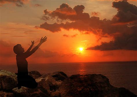 Royalty Free Silhouette Of Woman Kneeling In Prayer Pictures Images