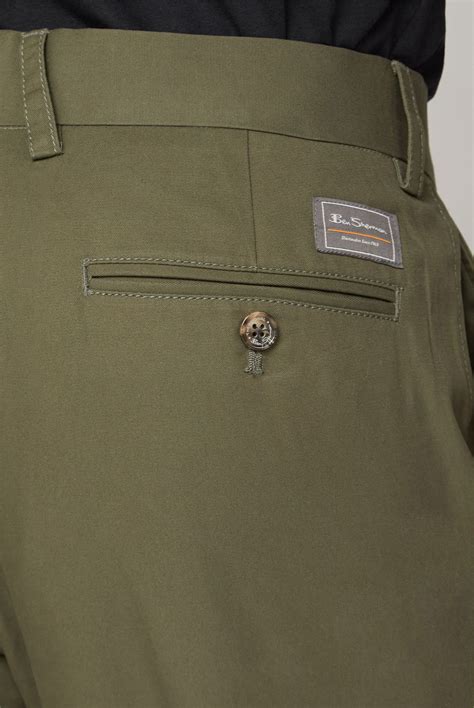 Exceptional softness and an uncompromising fit for natural stretch and comfort. Ben Sherman | Men's Olive Slim Fit Cotton Chinos | Suit Direct