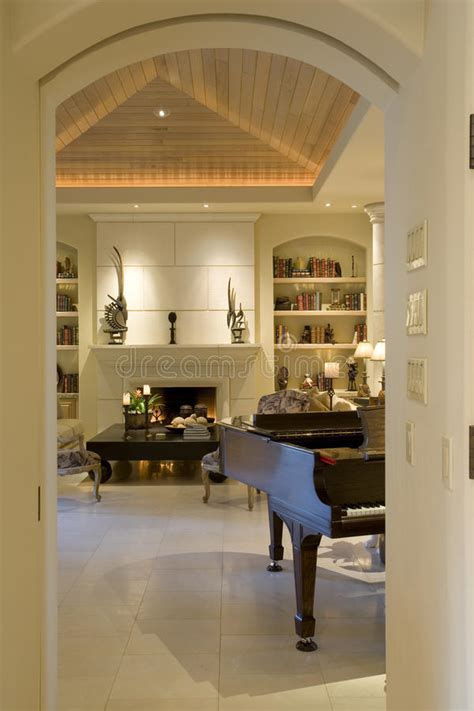 Romantic and relaxing piano jazz and crackling fireplace. Cropped Piano Against Shelving And Fireplace In Living ...