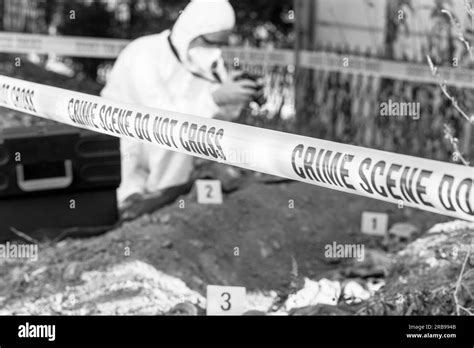 Crime Scene Investigation Forensic Science Specialist Working On Human