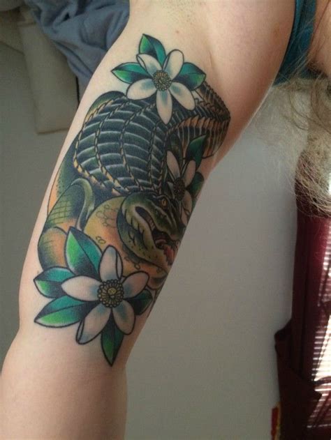 Green alligator crocodile head for tattoo or mascot design. Impressive Alligator With Flowers Tattoo On Right Half Sleeve | Alligator tattoo, Lizard tattoo ...