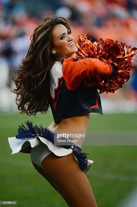 a denver broncos cheerleader performs during the game against the denver bronco