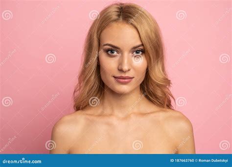Beautiful Sensual Topless Woman With Long Blonde Hair Posing Isolated Over Pink Background