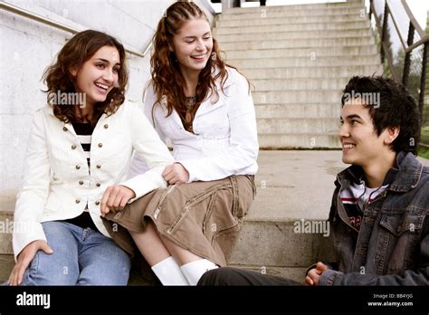 Teenager Group Smiling Sitting On Stairs Stock Photo Alamy