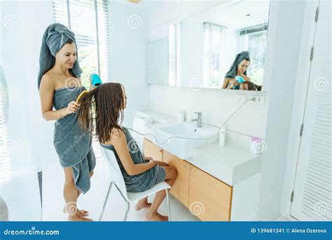 Mom Brushing Hair To Her Daughter In Hotel Bathroom Stock Image Image