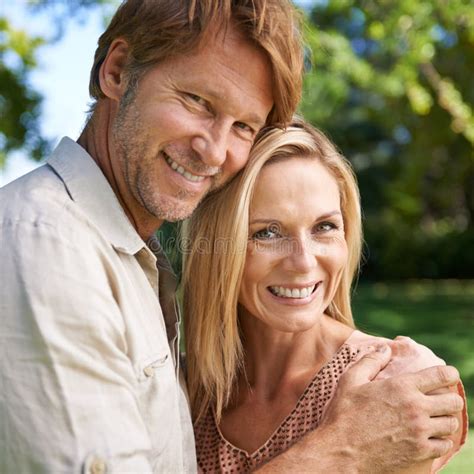 Our Love Is Forever Portrait Of An Affectionate Mature Couple Enjoying A Day In The Park Stock