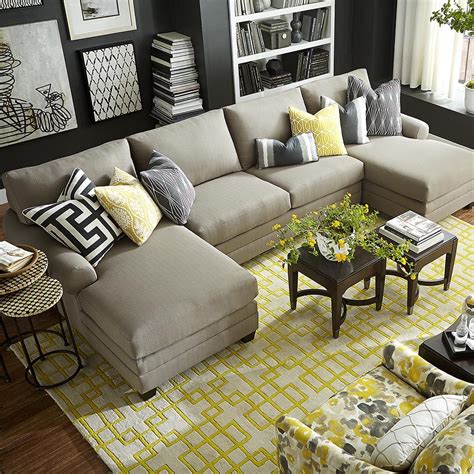 A side table topped with. Cu.2 Double Chaise Sectional Sofa, T-Cushion, Fabric in ...