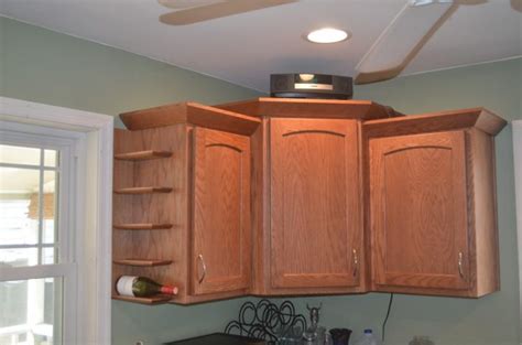And good luck finding any oven mitts. How To Use The Empty Space On The Side Of Kitchen Cabinets