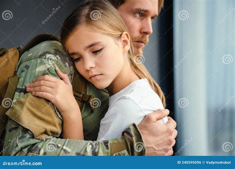 Masculine Sad Military Man Hugging Her Upset Daughter Stock Photo