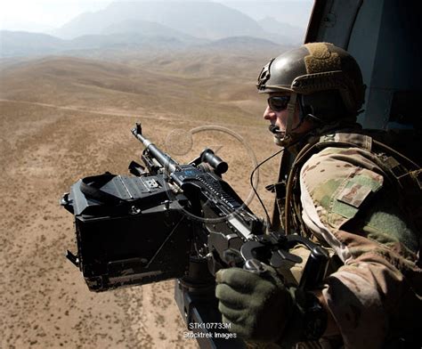 Door Gunner Scans The Terrain Over Afghanistan Stocktrek Images