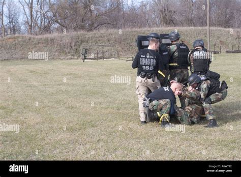 Swat Team Training Retrieving Injured Officer From Line Of Fire Hot