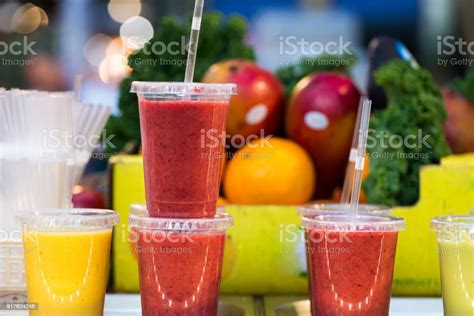 Close Up Of Fresh Fruit Smoothies And Juices In A Row For Sale On