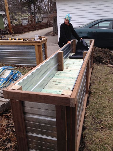It's to stop movement and give the bed a firmer standing. Building a Self Watering Raised Garden Bed - Frugal Living ...