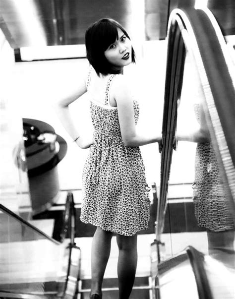 Cute Asian Girl In Dress On Escalator Free Image Download