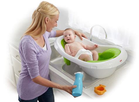 • fit the baby stopper insert into the bathtub, as shown. Amazon.com : Fisher-Price 4-in-1 Sling 'n Seat Tub : Baby