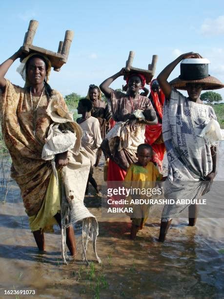 african woman carrying on her head photos and premium high res pictures getty images