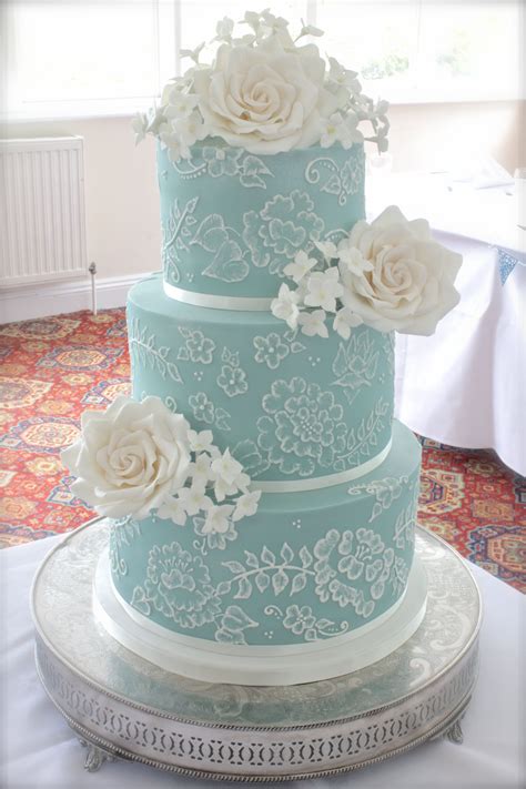 Turquoise Three Tier Wedding Cake With Brush Embroidery And Sugar