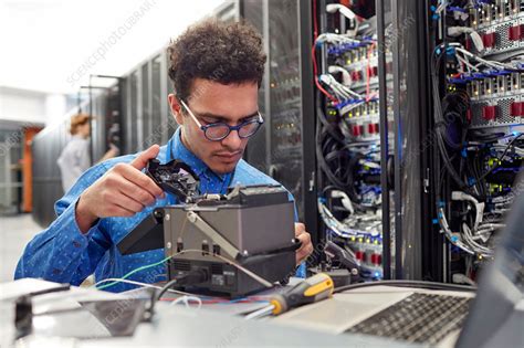 Male It Technician Fixing Equipment In Server Room Stock Image F020