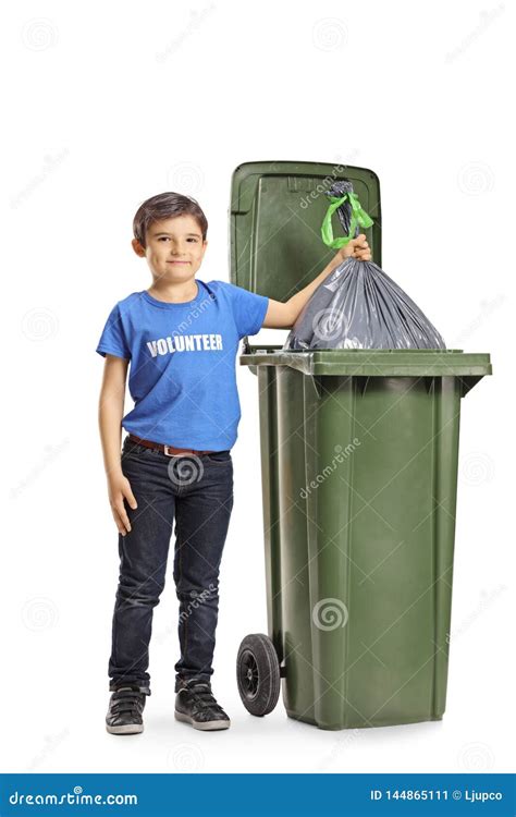Boy Volunteer Throwing A Waste Bag Into A Bin Stock Image Image Of