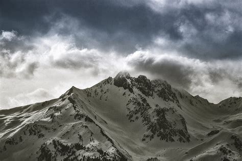 Of Snow Capped Mountain Under Cloudy Sky Hd Wallpaper Peakpx