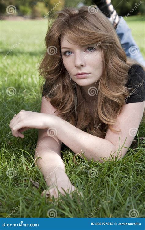 Portrait Of A Beautiful Woman With Long Red Hair And Green Eyes Stock