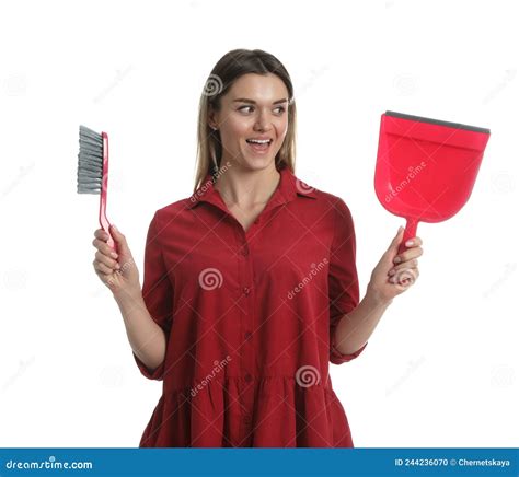 Young Woman With Broom And Dustpan On White Background Stock Photo