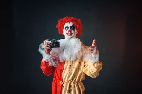 Premium Photo Scary Bloody Clown With Crazy Eyes Makes Picture