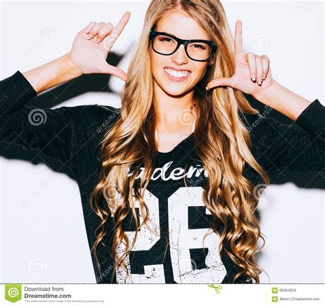 Very Beautiful Blonde Girl Hipster With Long Hair In Fashion Glasses