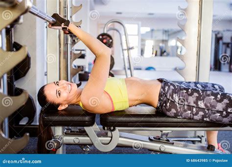 Fit Woman In A Gym Bench Pressing With Weights Stock Image Image Of Active Leisure 68643985