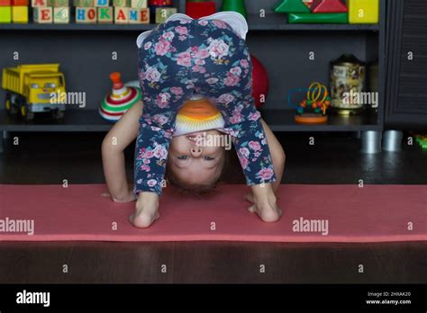 Little Girl Bending Down Making Physical Training Stock Photo Alamy