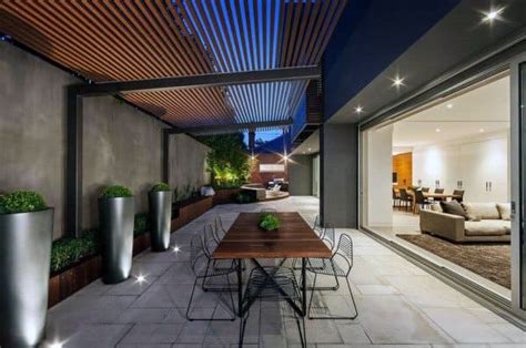 Lay these square patio tiles in a manner that leaves space between them to allow grass to grow. Top 70 Best Modern Patio Ideas - Contemporary Outdoor Designs